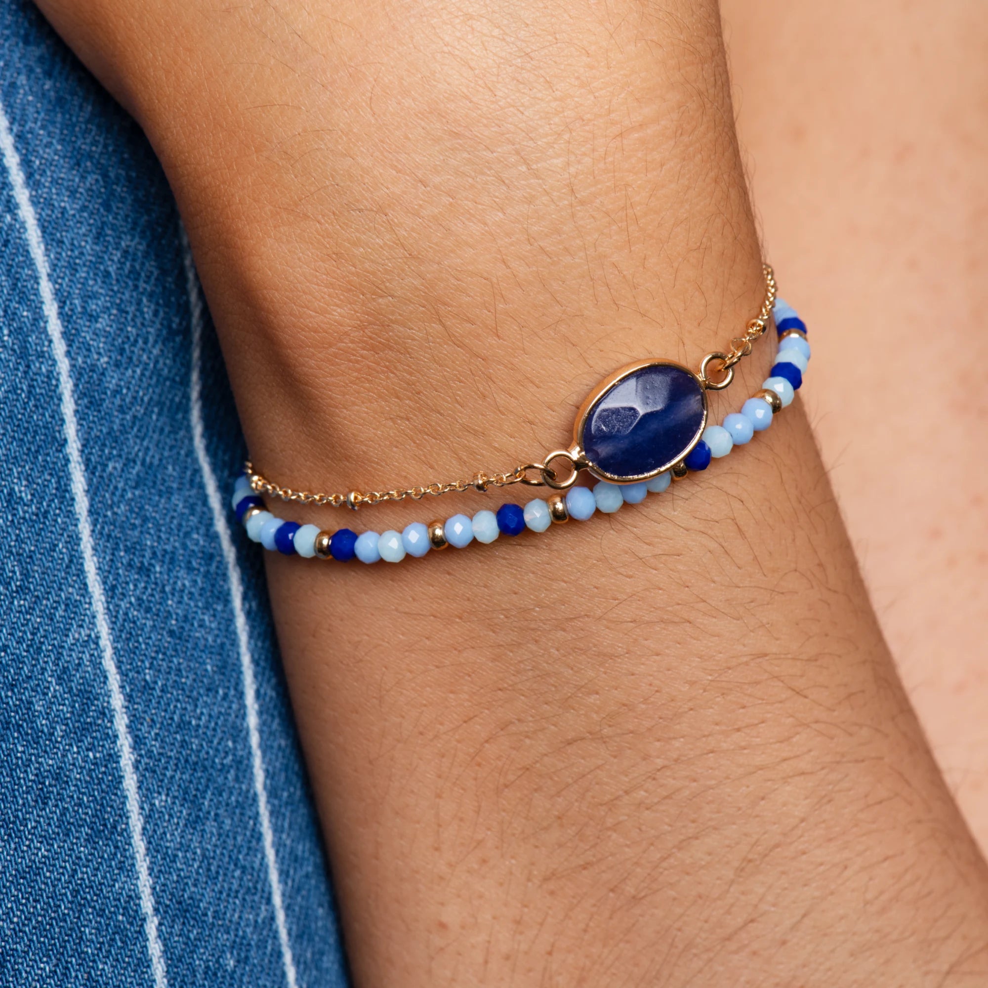 gold-blue-beaded-bracelet-close-up-on-model
