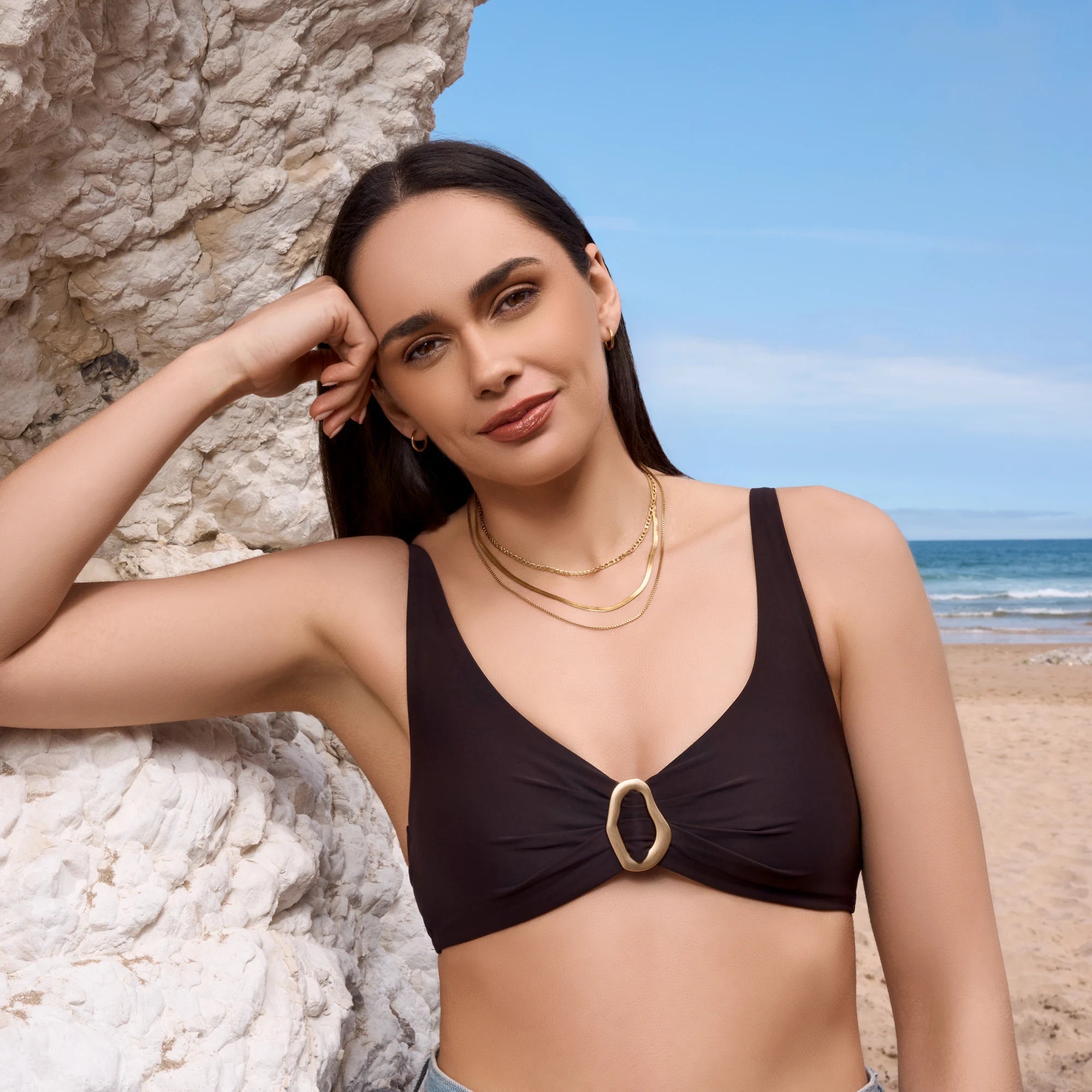 stainless-steel-waterproof-gold-chain-blue-pendant-necklace-close-up-on-model