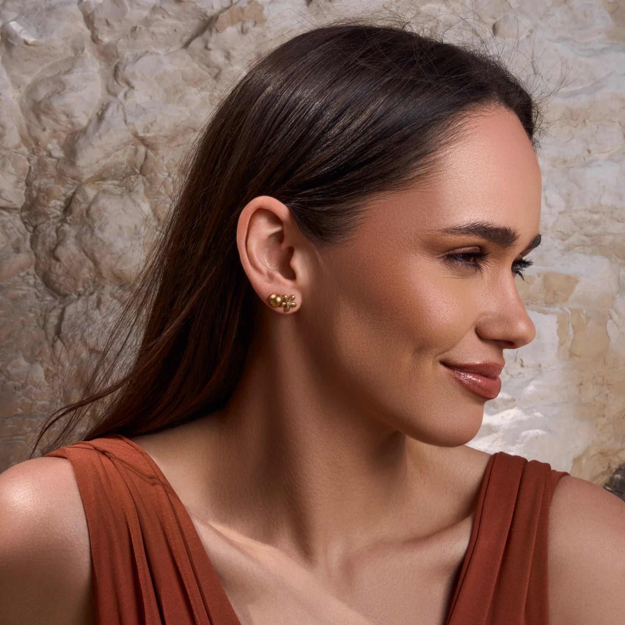 female-model-wearing-stainless-steel-waterproof-gold-flower-stud-triple-earring-set