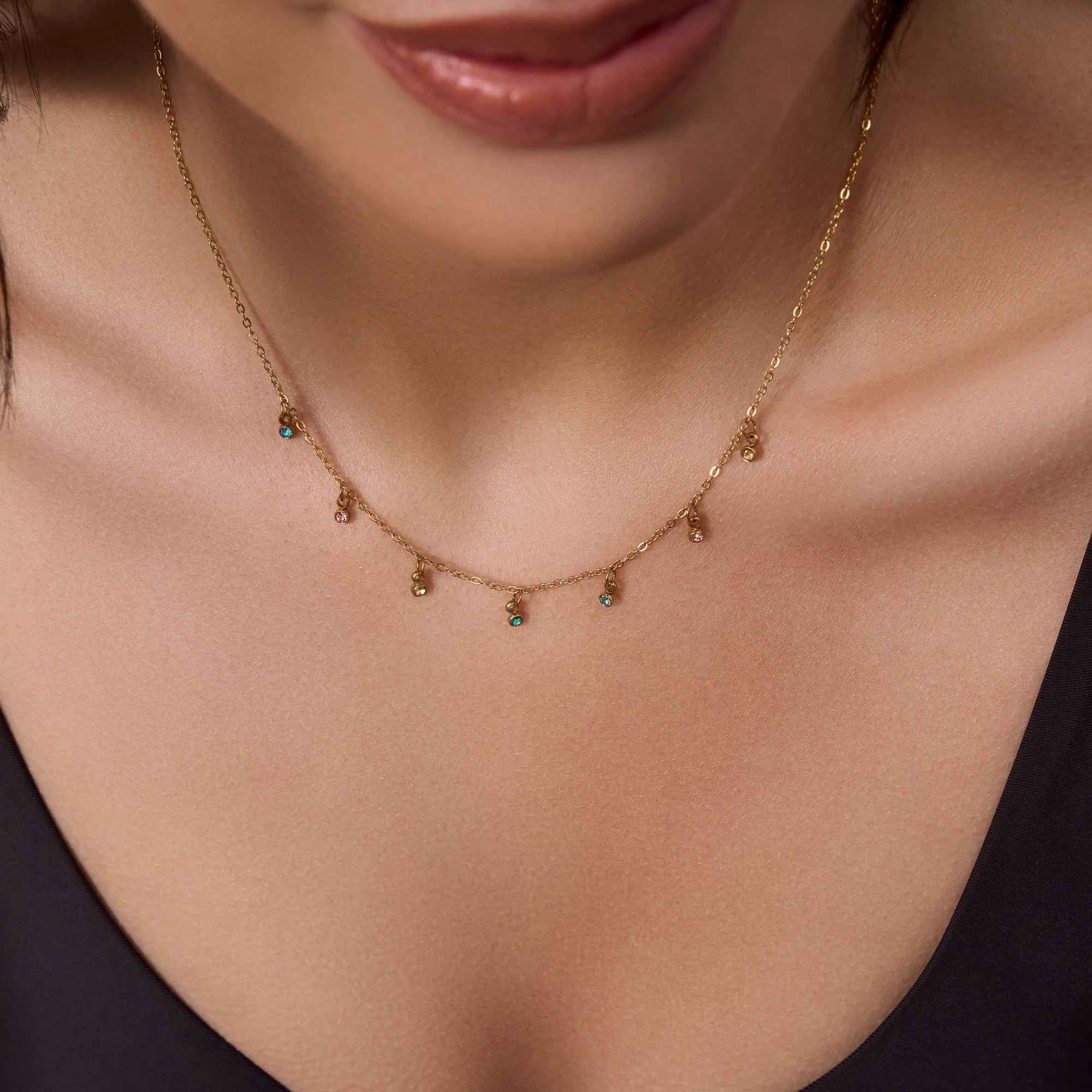 stainless-steel-waterproof-gold-colourful-cz-necklace-close-up-on-model