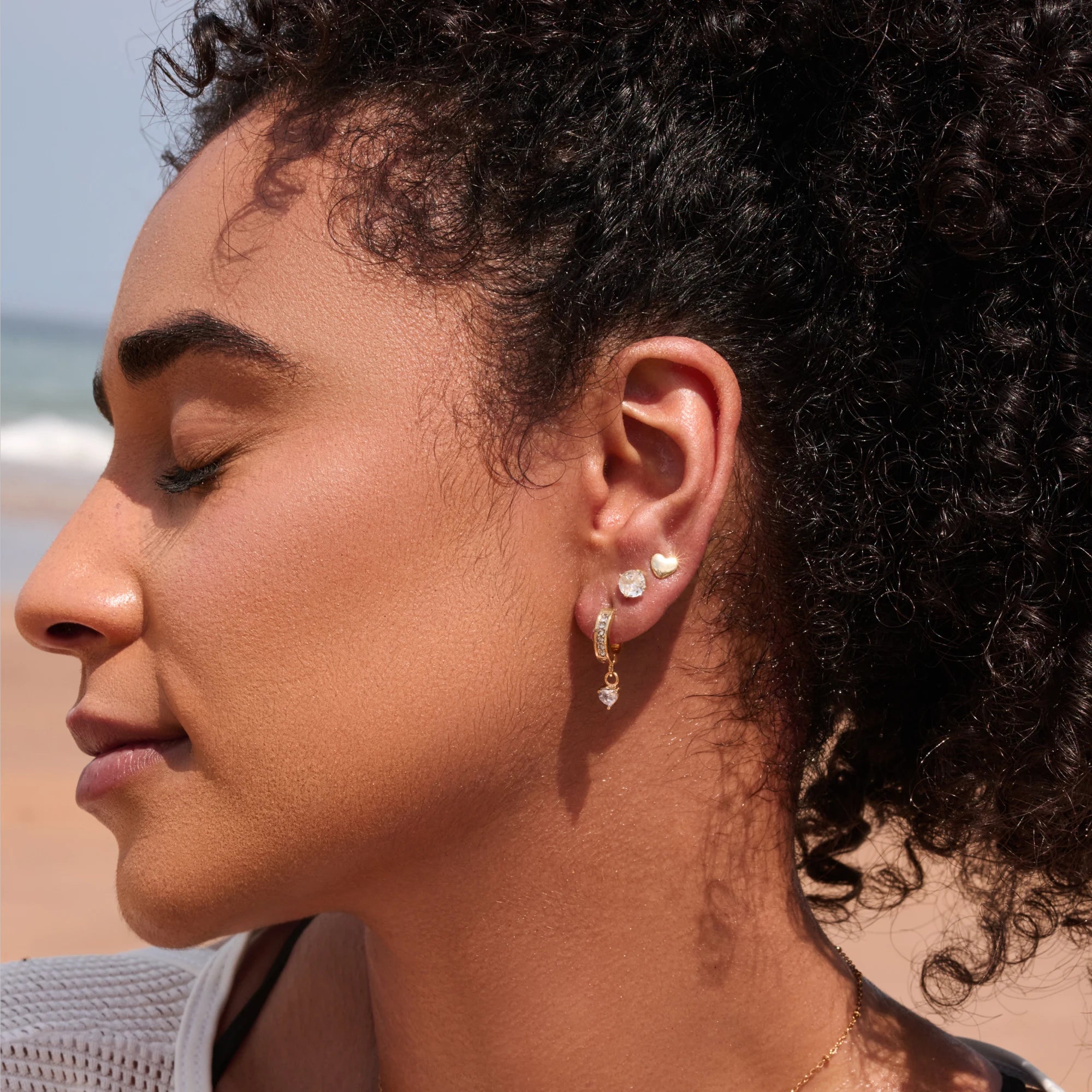 Close-up of a woman wearing earrings with a blurred background
